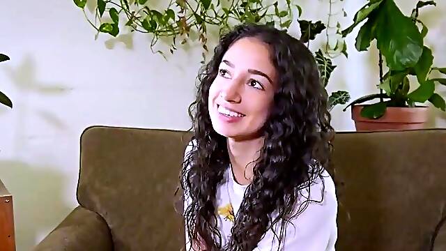 Sexy dark-haired toys with a wand and flashes off her