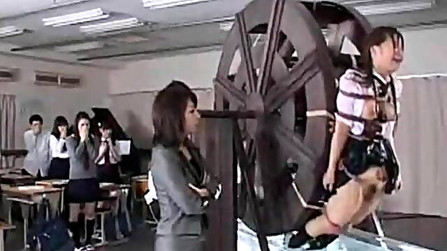 Kinky Asian schoolgirls getting trained on the water wheel