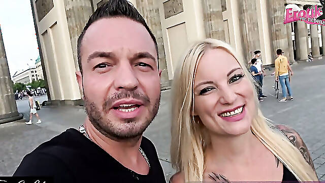 Bold Lovers Engage in Risky Public Passion at the Brandenburg Gate