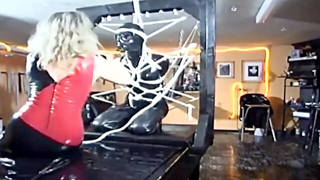 Latex Bondage Slut Suffering Mercilessly at the Hands of Masters