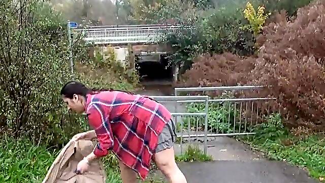 Flashing her large titties and bulky snatch